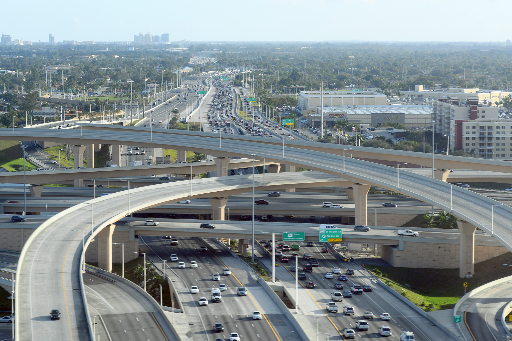 Aerial view of the SR 836/826 Road Construction interchange in Miami-Dade County, showcasing multi-level roadways and heavy traffic flow, emphasizing the complexity of this major highway junction.
